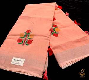 Peachy pink colour linen saree with embroidery work