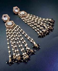 Earrings: Black Pearls and kundan work long earrings
