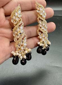Earrings: Black Pearls and kundan work long earrings