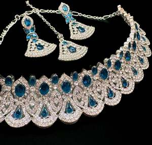Necklace: Silver jerkan stone beautiful choker necklace with earrings and tikka set