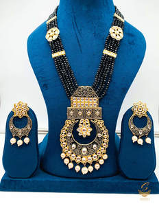 Rani Haar Long Necklaces: Black colour meenkari with kundan work pendant Long rani haar with pearl work set with beautiful design earrings