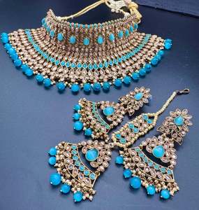 Bridal Necklaces Semi Bridal Necklaces: (video clip attached )Blue color Beautiful and elegant look Original Polki stones with pearls studded very Heavy work necklace with beautiful bigger size earrings and Tikka Note :- original Polki stones not fake plastic stones )