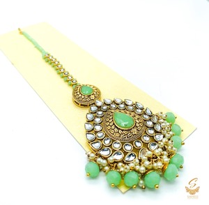 Maang Tikka And Matha Patti: Pastel mint Pearls with kundan stone beautiful tikka