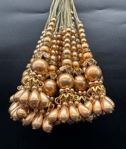 Beautiful golden design small size lehnga latkans tessels (pair)