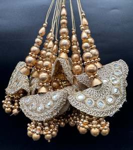 Beautiful golden design medium size lehnga latkans tessels (pair)
