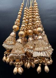 Beautiful golden design medium size lehnga latkans tessels (pair)