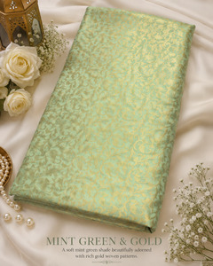 Fabrics: Mint green brocade silk Fabric (price per meter) perfect for stitching blouses /skirts /suits (aprox 112cm width )slight variation in color may occur