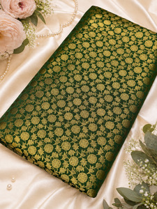 Fabrics: Green brocade silk Fabric (price per meter) perfect for stitching blouses /skirts /suits (aprox 112cm width )slight variation in color may occur