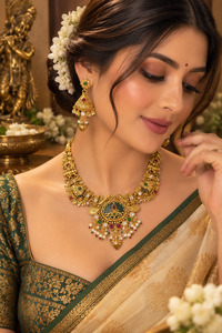 Elegant South Indian temple-style necklace set in a rich gold finish, detailed w&hellip;