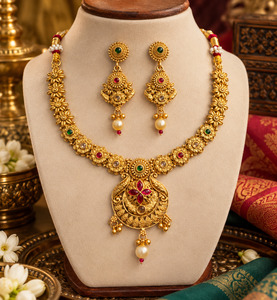 Elegant South Indian temple-style necklace set with intricate floral detailing, &hellip;