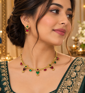 Elegant matte gold-finish green ,Ruby stone accents. Comes with matching earring&hellip;