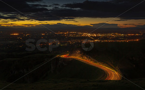 Products: Darkness over Havelock North and Hastings, with traffic on the Te Mata Peak Road, Havelock North, Hawke's Bay, New Zealand - SCP Stock