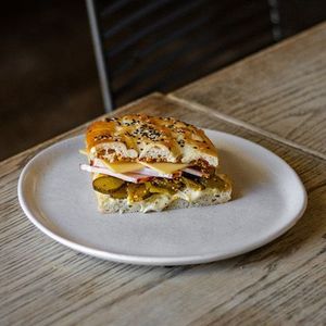 Products: Glazed Ham, cheddar, mustard, pickles & bechamel on Turkish Pide