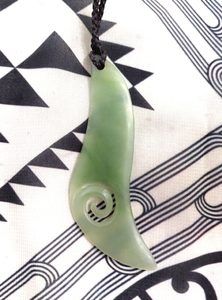 Products: Inanga Pounamu Freeform Drop with Koru (D7)