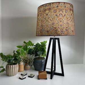 Stands: Black tripod table lamp, eastern paisley