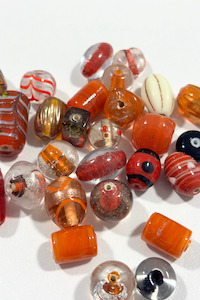 Under 20: Beautiful, assorted orange glass beads