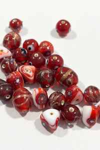 Fabrics: Assorted red Italian glass beads