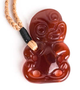 Womens Necklaces: Hei Tiki Red Carnelian pendant on hand woven strand