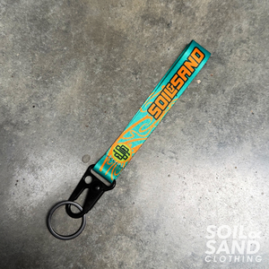 Products: Wrist Keychain – Teal Soil and Sand