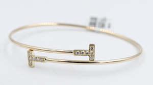 Gold Bracelets: 10K Gold Diamond set Flex Bangle with TDW 0.20ct