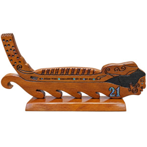 Handmade Swamp Kauri Waka 21st Key on stand 570mm