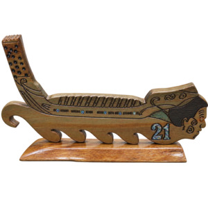 Handmade Swamp Kauri Waka 21st Key on stand 570mm