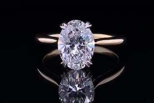 Oval Double Claw Tapered Solitaire