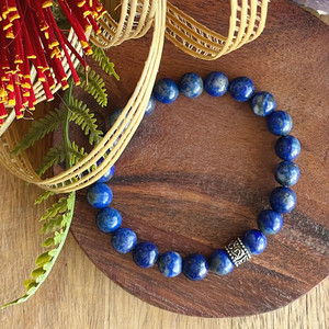 Products: Lapis lazuli with Om Mani Padme Hum charm, stretch bracelet Strength Within