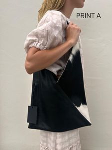 X L A B Wanderer Handbag Collection: Xox Black Leather & Cowhide Bag