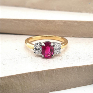 Ruby: Ruby & Oval Diamond 18ct Yellow and White Gold Three Stone Ring