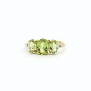 Peridot: Peridot 9ct Yellow Gold and Diamond Oval Three Stone Ring