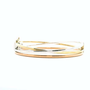 Elizabeths Edit: 9ct Tri Tone Hollow Cross Over Hinged Bangle
