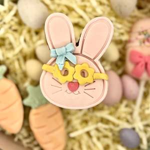 Easter 2025: Easter bunny cookie - yellow glases, blue bow
