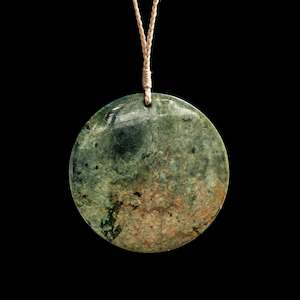 Handcarved Jade disc by Alex Sands