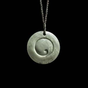 Necklaces: Jade disc pendant with korus by Nick and Mady