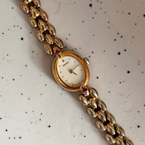 Birth Year Watches 1990: Seiko Rice Bracelet Watch with inlaid Rubies