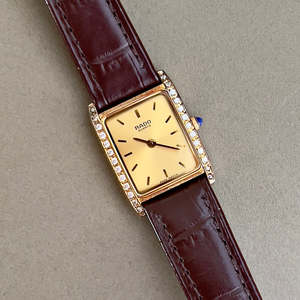 Birth Year Watches 1993: Rado Tank Gold Toned Woman's Watch with Inlaid Diamonds