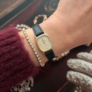 Omega Ladies Watches: Omega De Ville Two Tone Women’s Watch with Textured Dial & Wreath Bezel