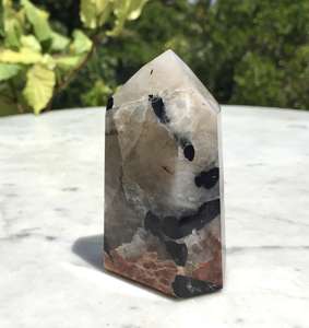 Black tourmaline and peach moonstone in quartz tower - The Hidden Gem