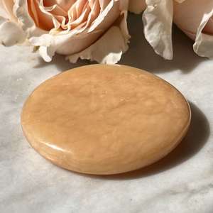 Orange calcite palmstone - The Hidden Gem