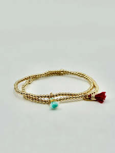 Dane Jewellery: DANE JEWELLERY - PETITE BURGUNDY TASSEL BRACELET - GOLD