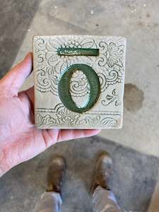 Art: Letter O with tohutō ceramic tile