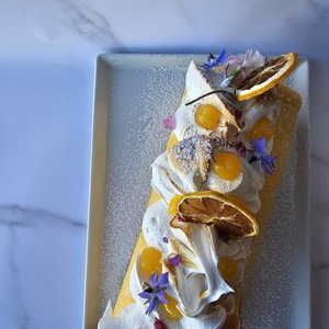 Products: Lemon and passionfruit Swiss roll with torched meringue