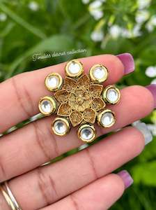 Golden ring in Kundan with antique look flower ( adjustable size )