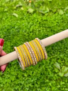 Yellow colour bangles with shiny golden kangan’s ( set of both hands )