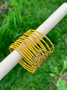 Yellow coloured thread bangles