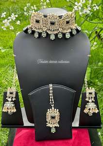 Black Colour Jewellery Options: Black choker / necklace set in Kundan with tumbler beads in meenakari with Jhumka included Sahara chains