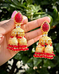 Red Jhumka drop earrings with curving stone in 22 KT gold plating ( high quality )