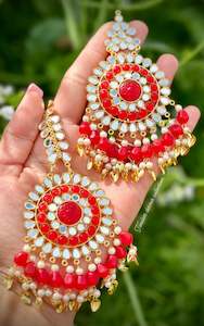 Red earrings and tikka set in mirror with pipal patti