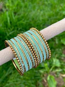 Pista or mint green velvet bangles set with golden beaded kangan’s